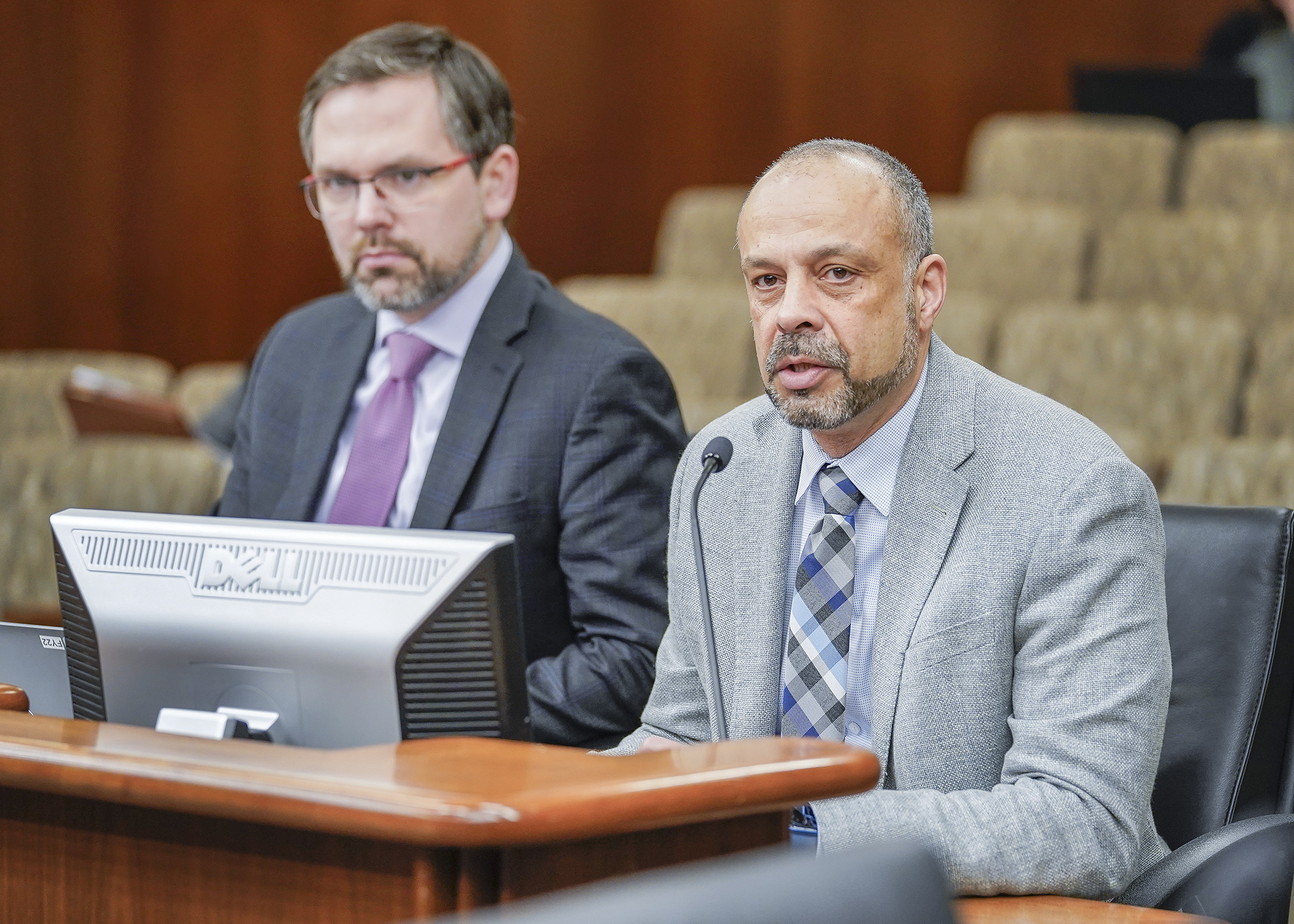 Commissioner Tarek Tomes, right, and Deputy Commissioner Jon Eichten present an overview of the governor’s recommended budget for Minnesota IT Services Jan. 26 to the House State and Local Government Finance and Policy Committee. (Photo by Andrew VonBank)
